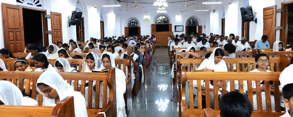 Congregation in prayer during worship service